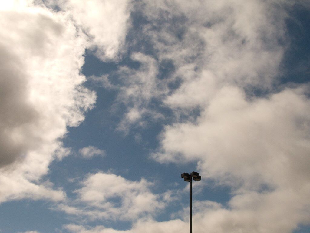Clouds over a lamp post. Stieglitz’s cloud photographs were his first “equivalents.”