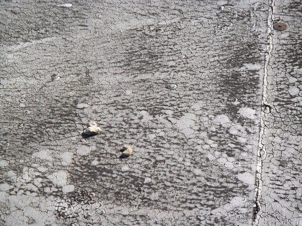 Concrete, close and flat-on, with only the surface at the edges.