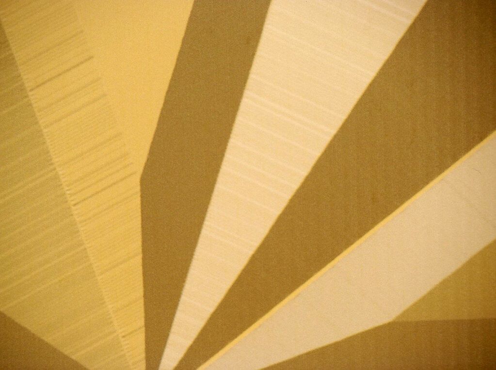 Yellow rays on a wall. Light and pattern are here too, and this week only the color counts.