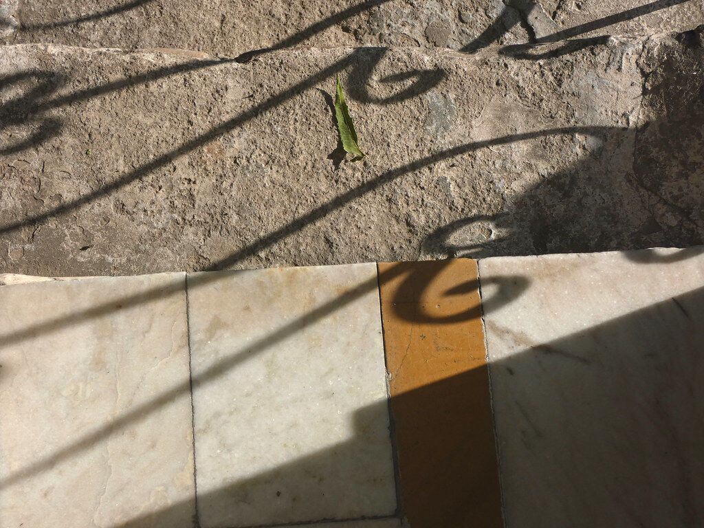 Shadow on steps. The same place looks different every hour.