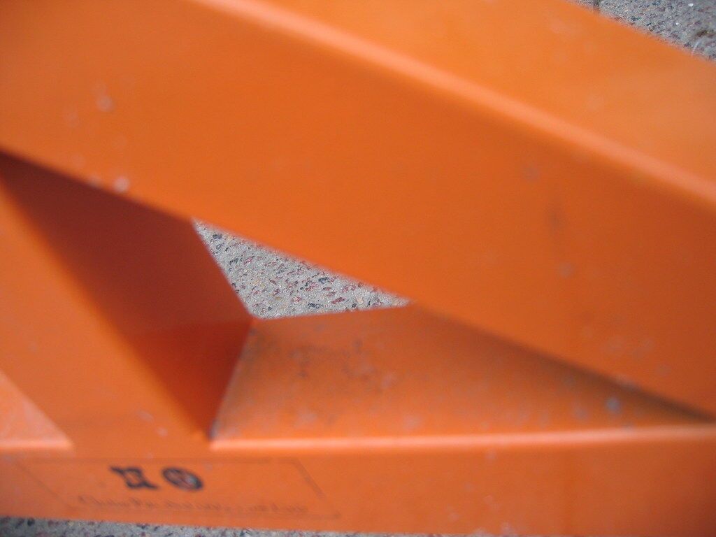 An orange rail, shot flat-on.