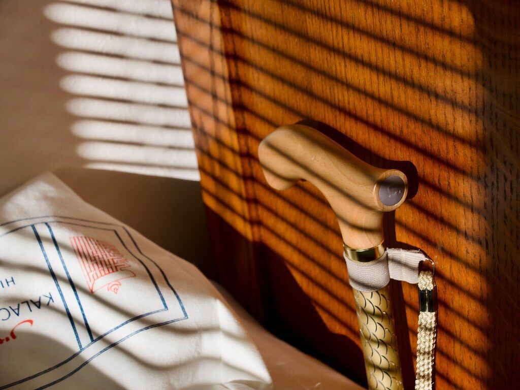 Light through blinds on wood.